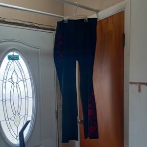 Black stretch pants with red flowers